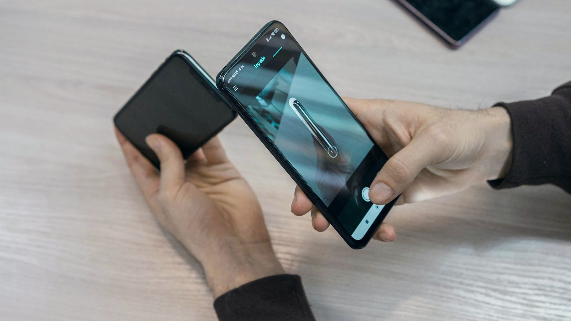 Hands using a phone app to scan at work